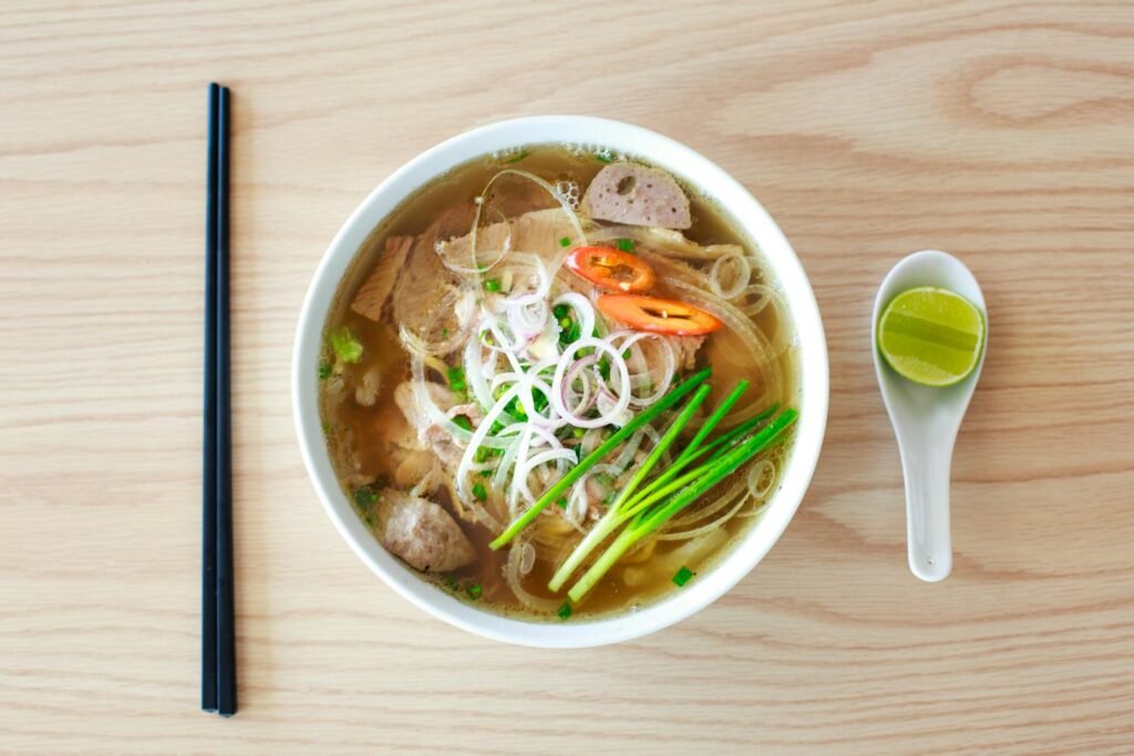 Authentic Vietnamese pho with fresh herbs and spices, perfect for a hearty meal.